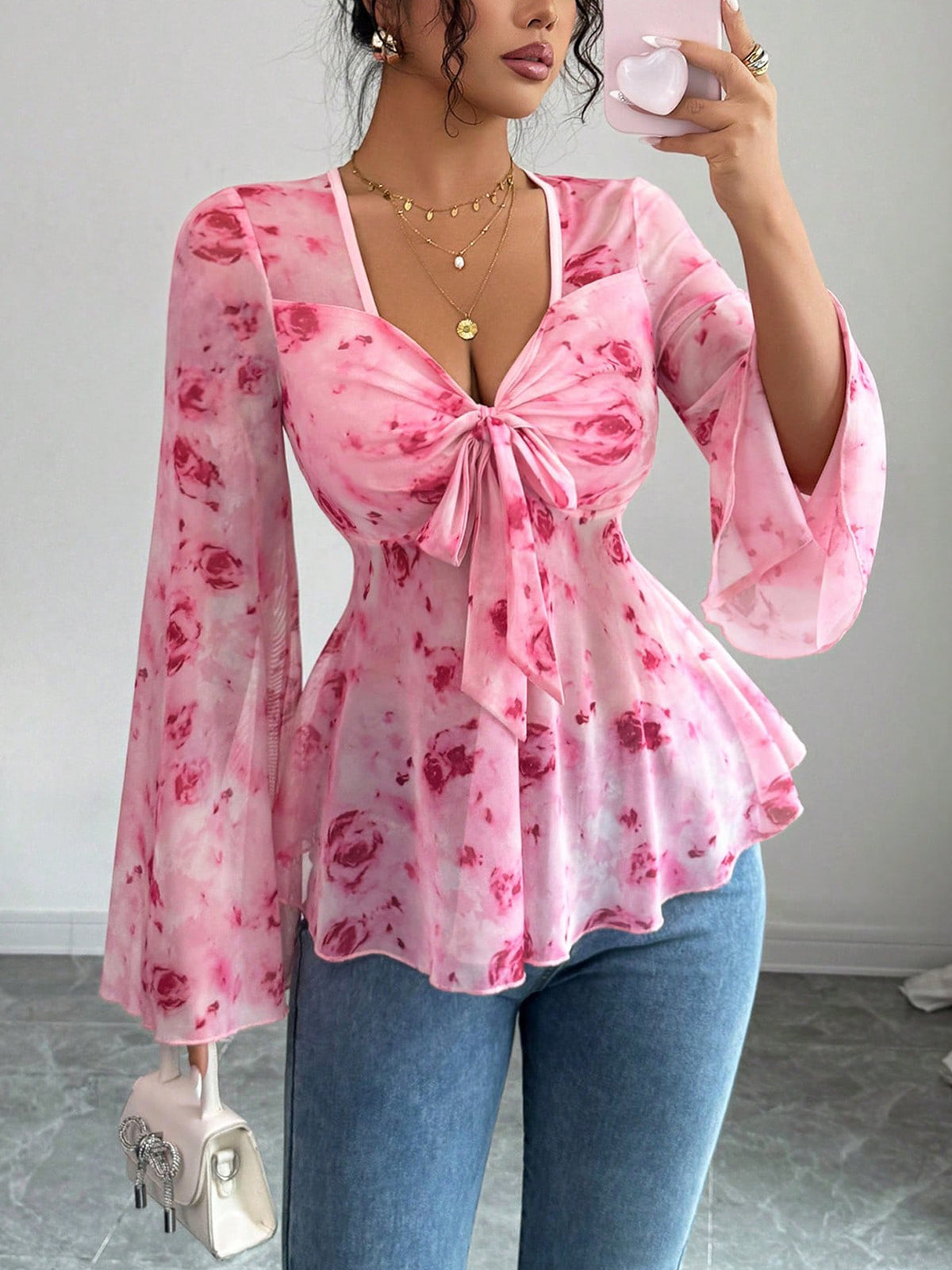 Floral print tie-front chiffon blouse with flare sleeves from Plush Fashion Hub, showcasing lightweight, feminine fabric and stylish design.