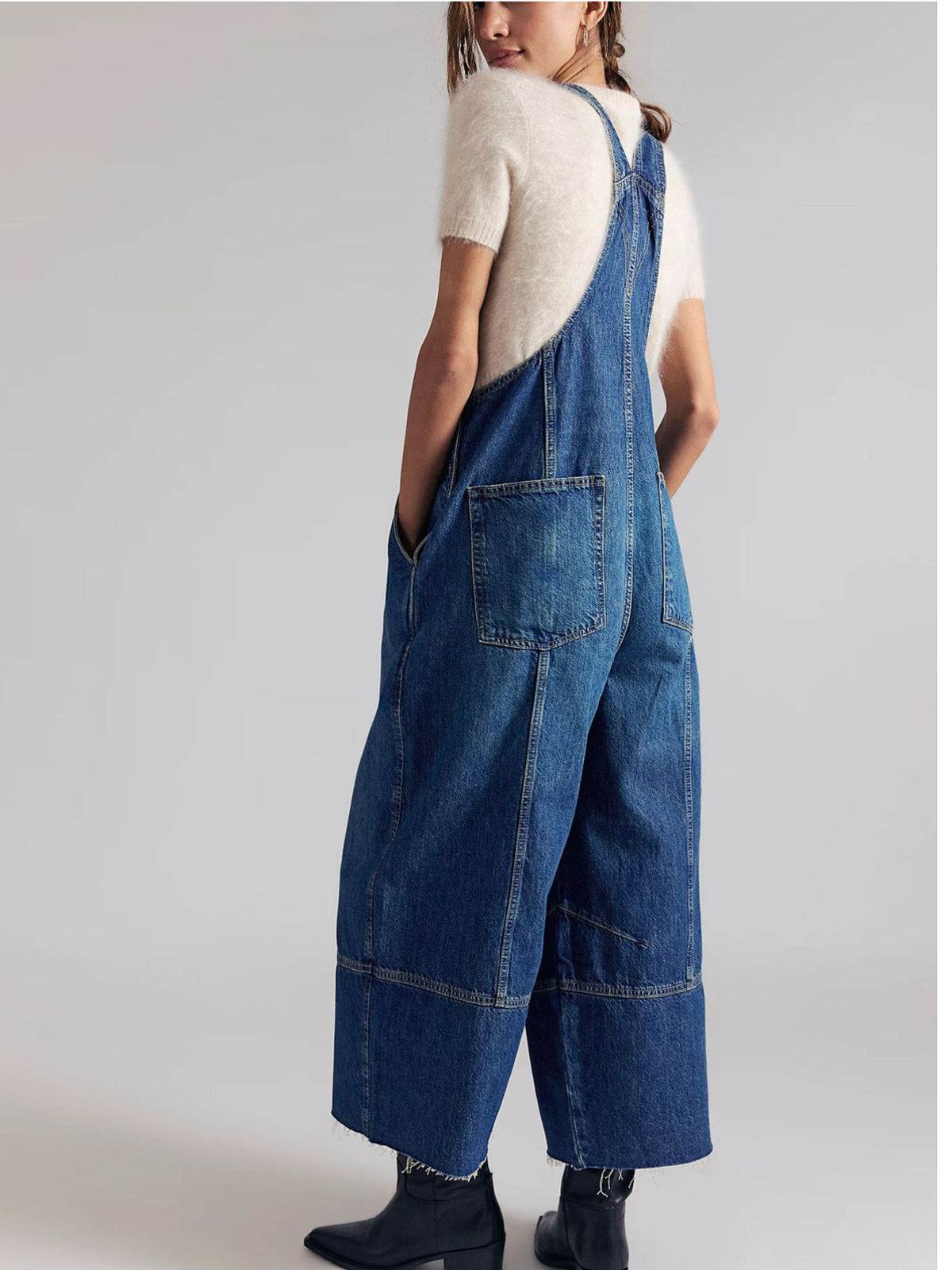 Lightweight casual denim jumpsuit with raw hem wide-leg style from Plush Fashion Hub, featuring adjustable straps and front pockets.