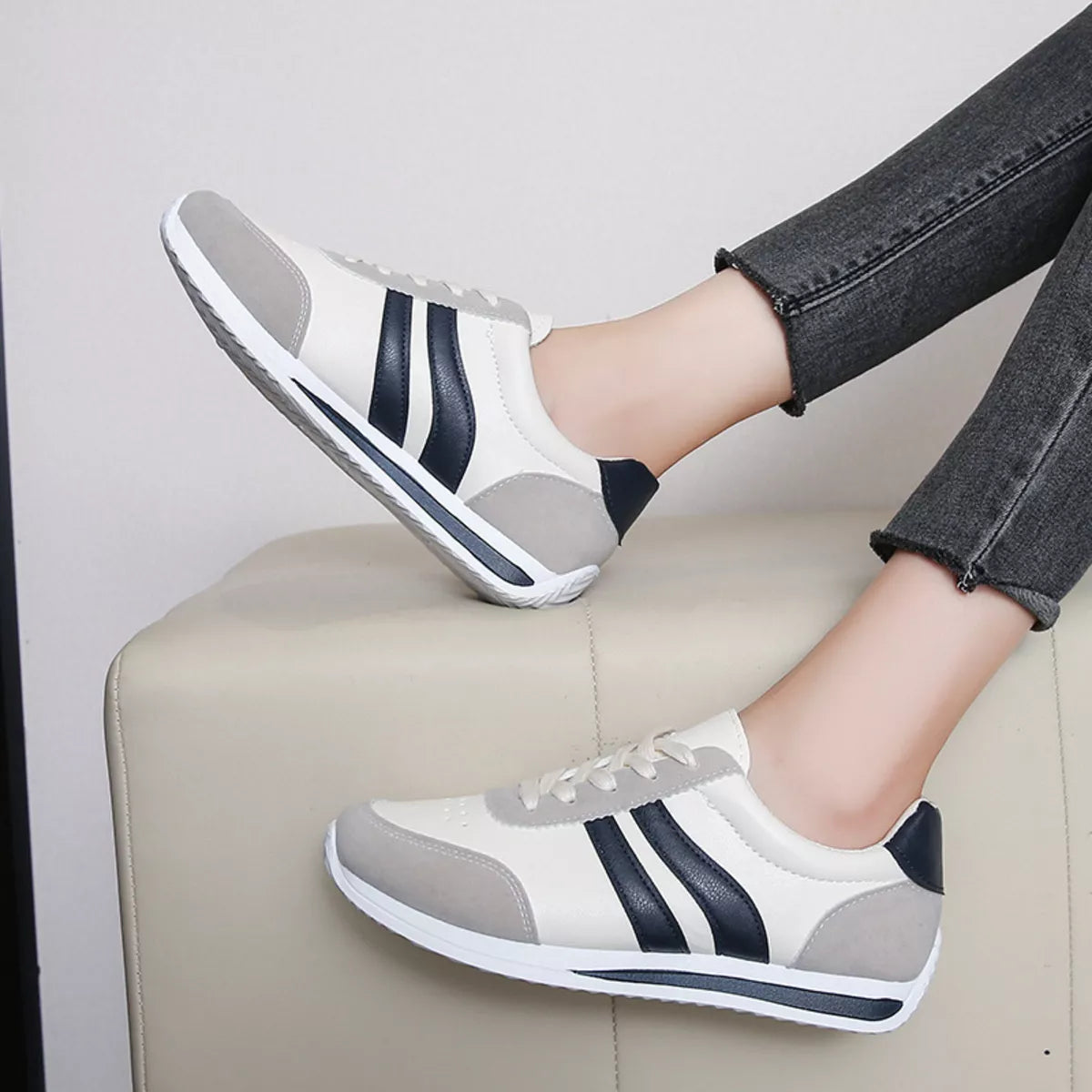 Women’s round toe lace-up sneakers by Trendsi, stylish casual sneakers with white laces and a comfortable rubber sole.