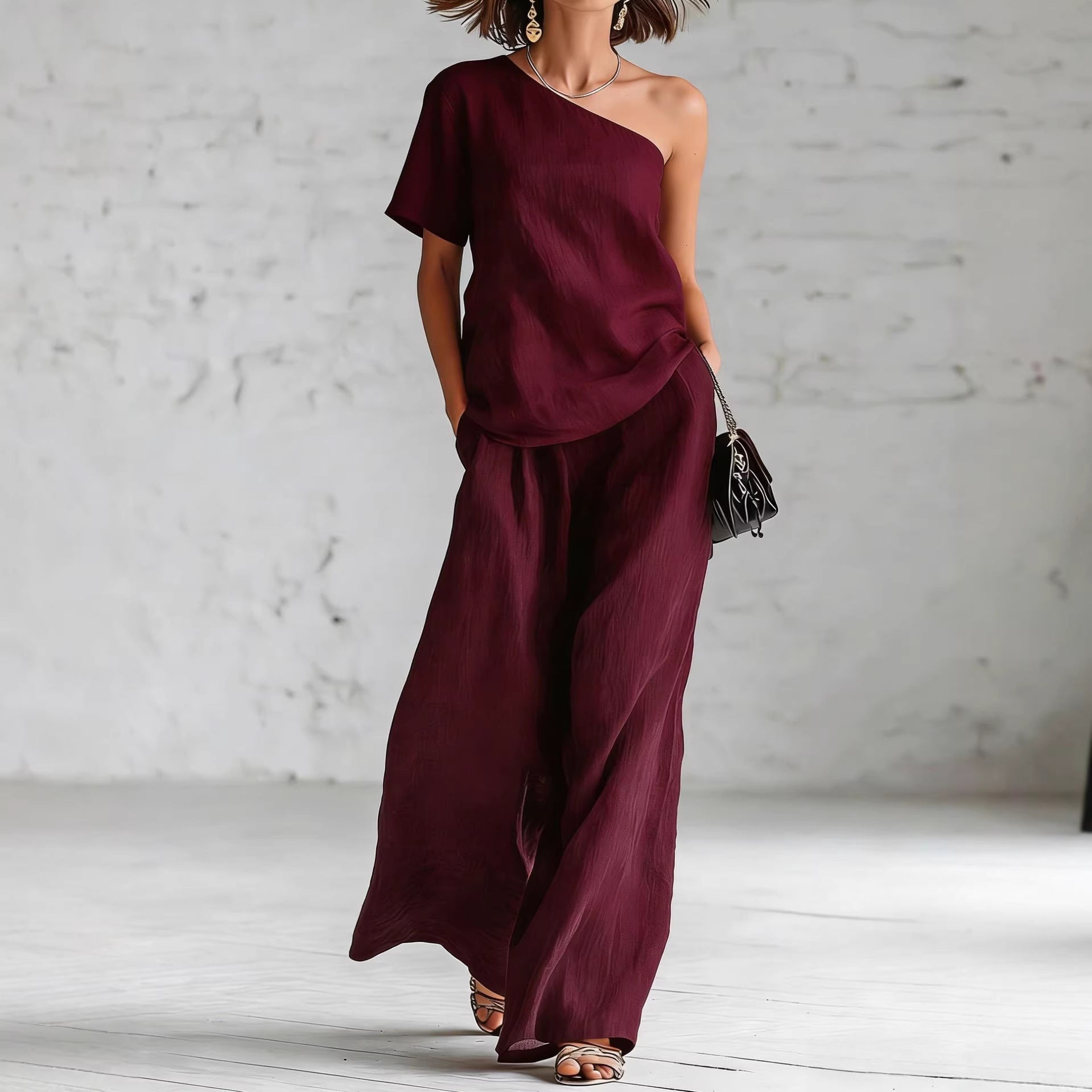 Women’s wide-leg pants and top set by FitiqueFit, casual 2-piece outfit with three-quarter sleeves, laid flat on a neutral background.