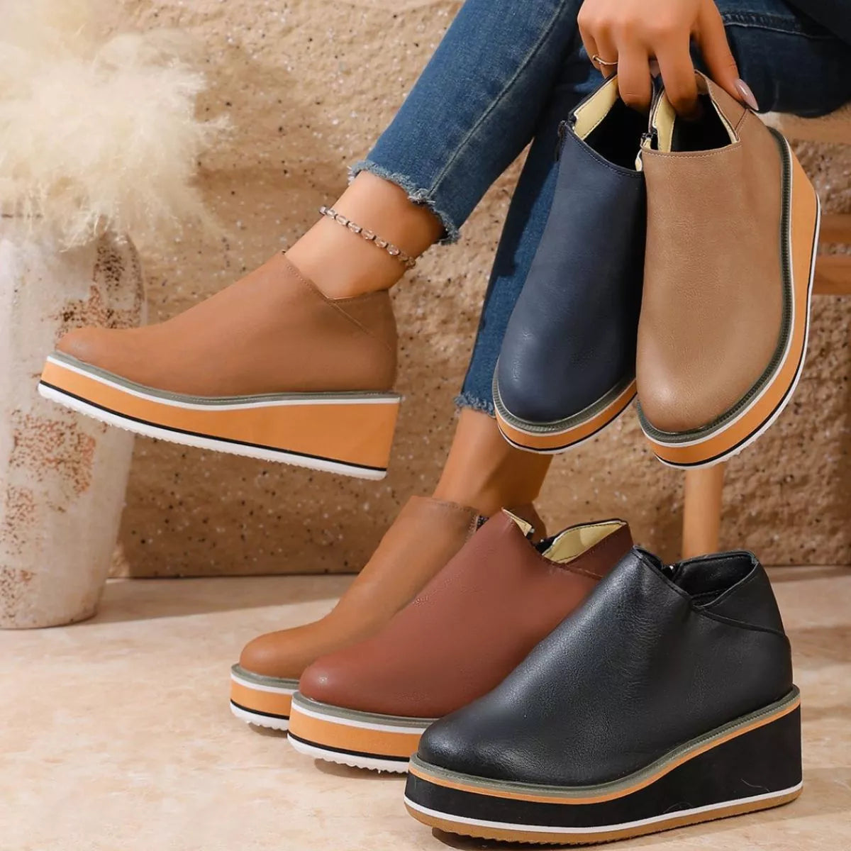 Women's round toe wedge ankle boots by Trendsi featuring a stylish design and ankle height in a versatile neutral color.