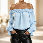 Women's ruffle off-shoulder blouse with 3/4 sleeves from Plush Fashion Hub, featuring elegant design and feminine details.