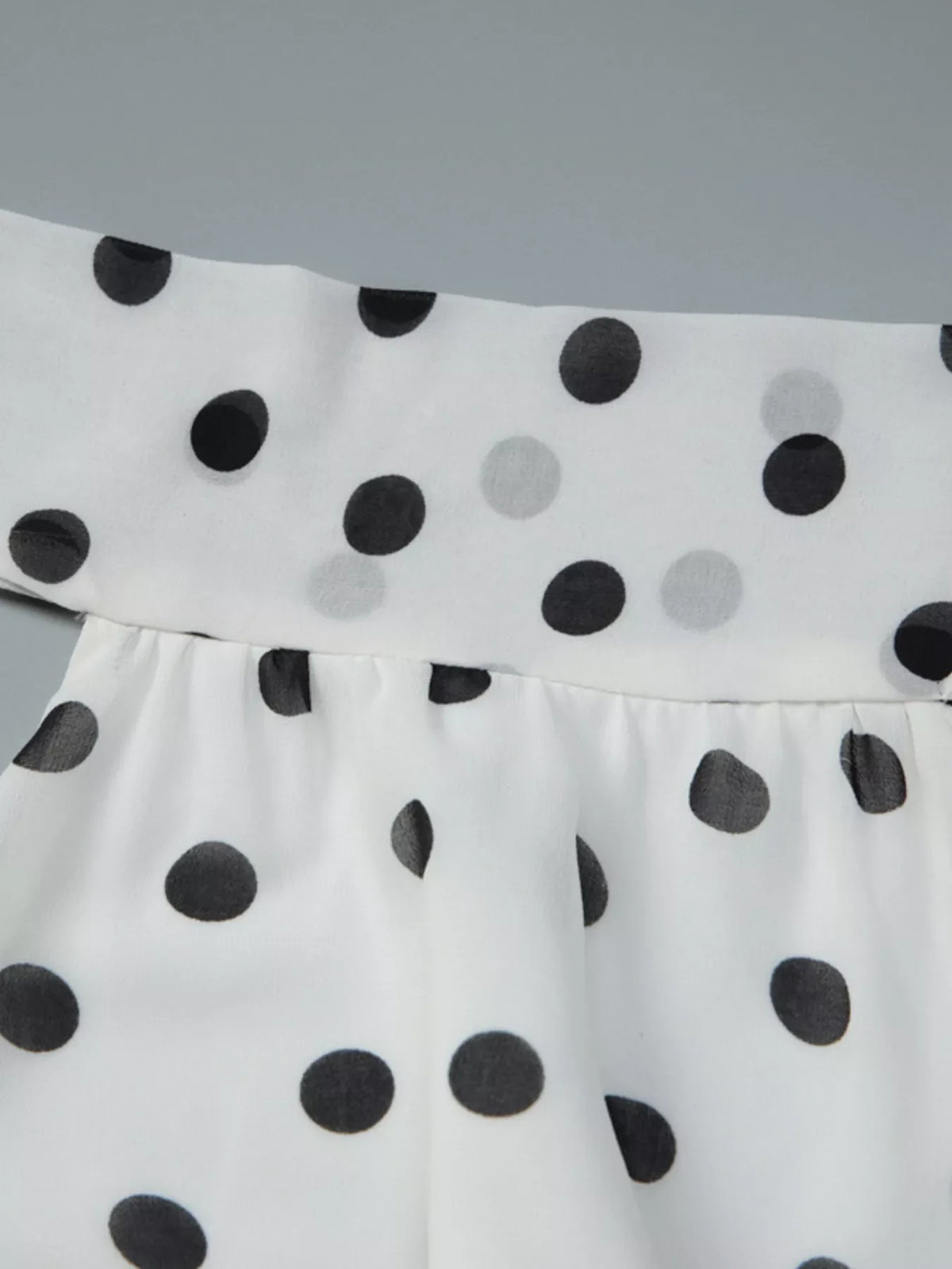 Polka dot halter neck ruffle dress by Plush Fashion Hub, featuring a stylish design with playful ruffles and a flattering fit.
