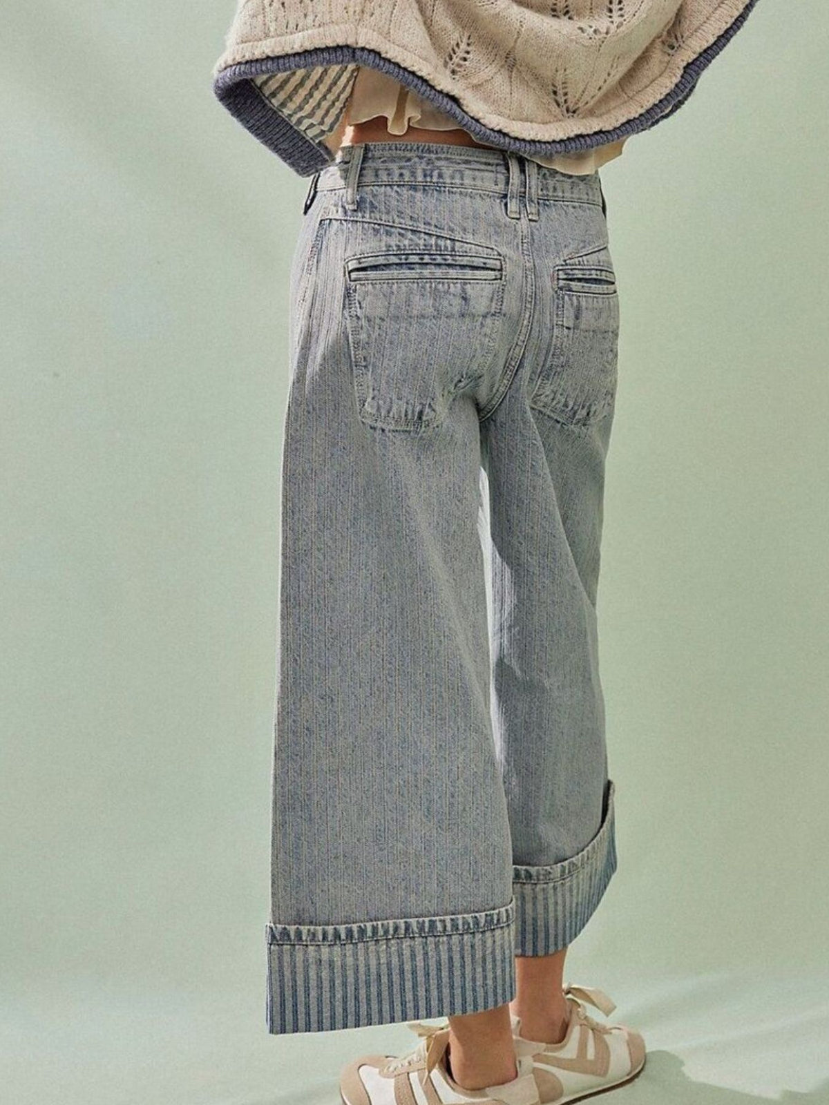 Plush Fashion Hub wide-leg cropped denim jeans with a relaxed fit and classic blue wash, displayed on a hanger.