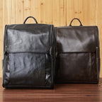 Black leather computer backpack from Pi-Mart with first-layer leather construction, multiple compartments, and padded shoulder straps.