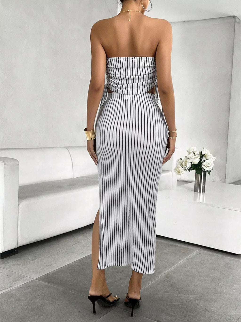 Striped tube top and slit skirt set by Trendsi, featuring a stylish matching two-piece design with bold stripes.