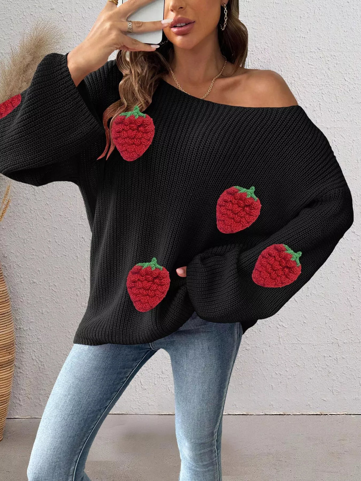 Oversized sweater with strawberry applique details, casual style, Trendsi brand, soft knit fabric, cozy and fashionable for everyday wear.