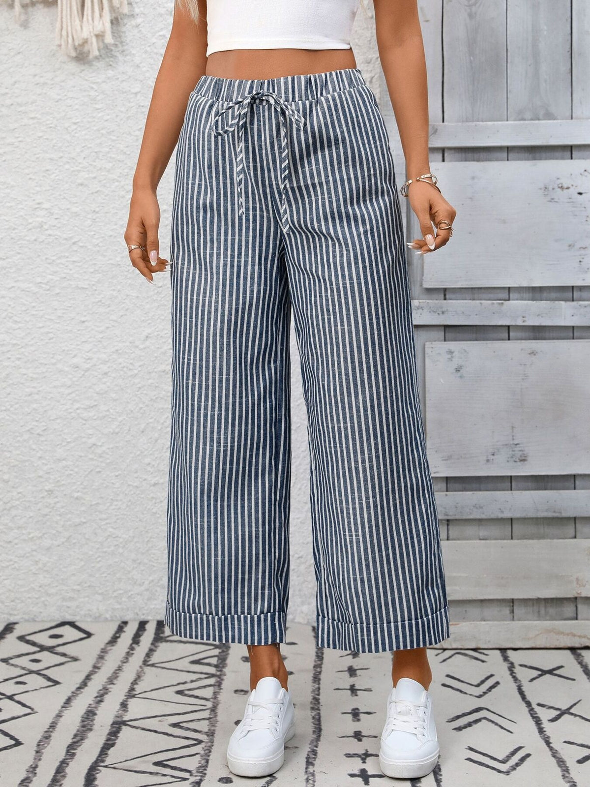Women’s striped wide-leg drawstring pants with pockets by Plush Fashion Hub, featuring a comfortable fit and stylish design.