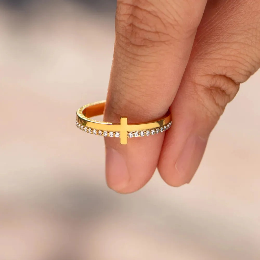 Sterling silver cross ring from Plush Fashion Hub featuring a detailed cross design on a sleek band.