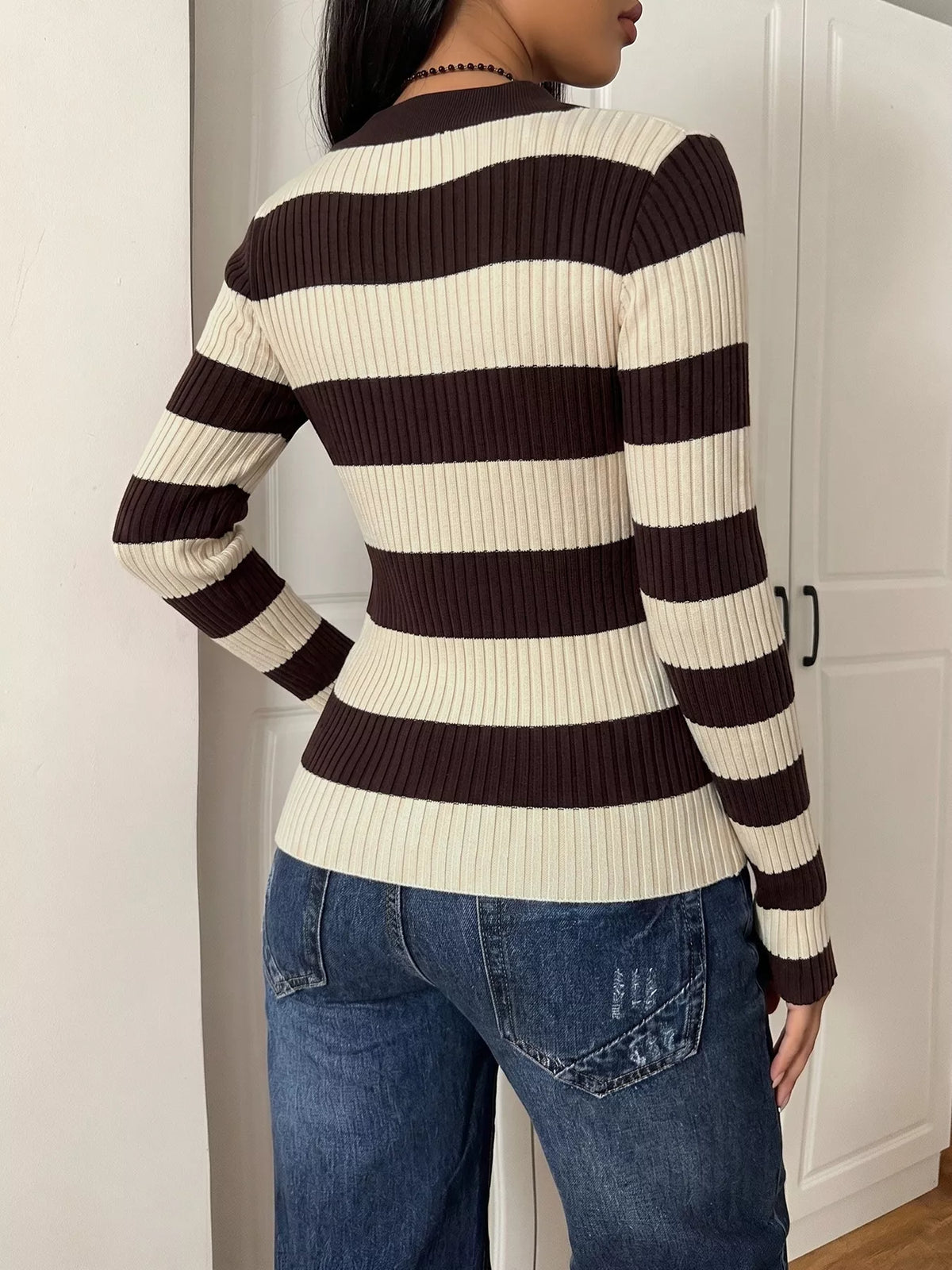 Striped ribbed knit long sleeve sweater shirt by Plush Fashion Hub, featuring a fitted design and classic striped pattern.
