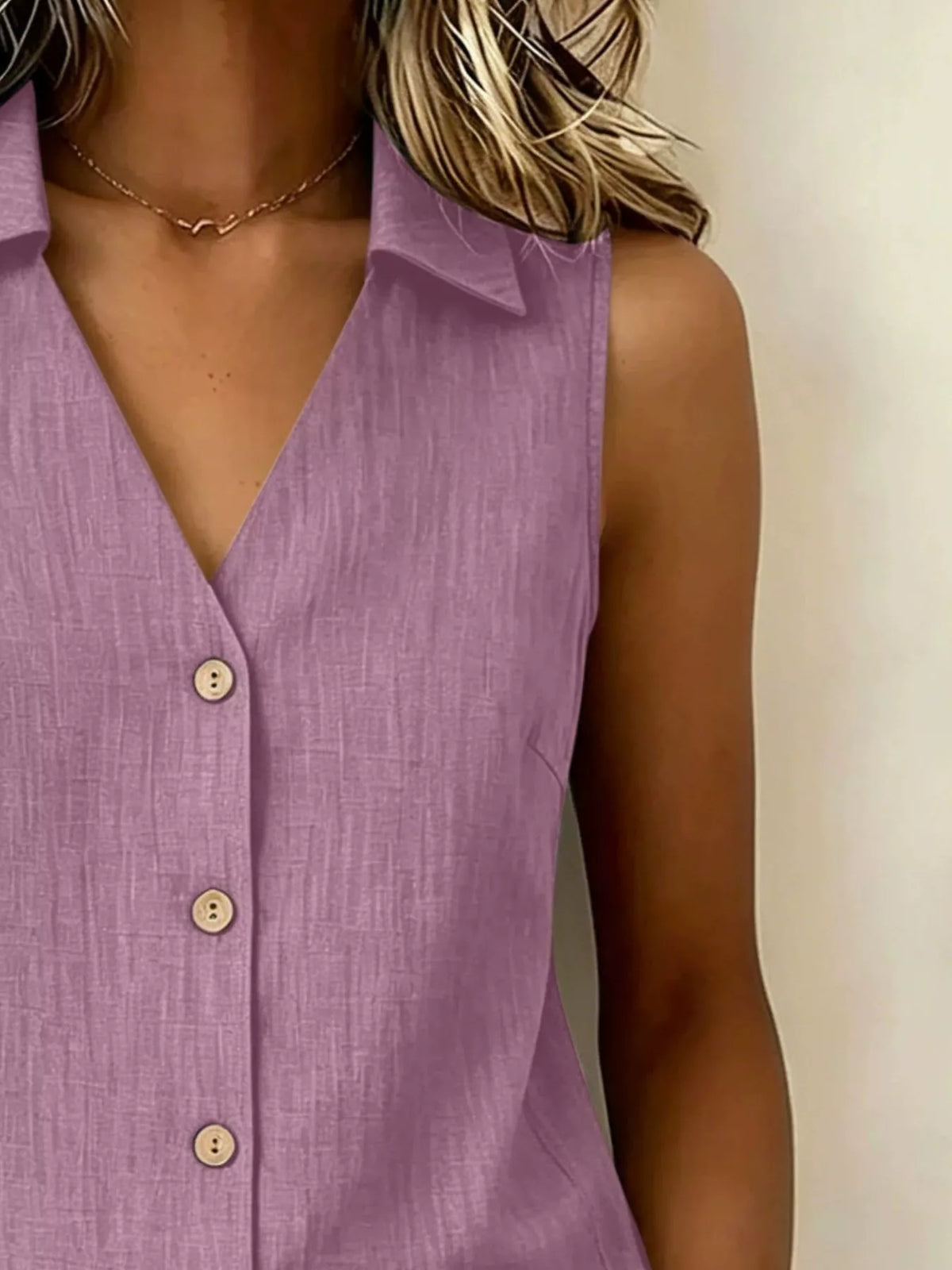 Plus size sleeveless button-up collared top from Trendsi, featuring a stylish full button front and classic collar.