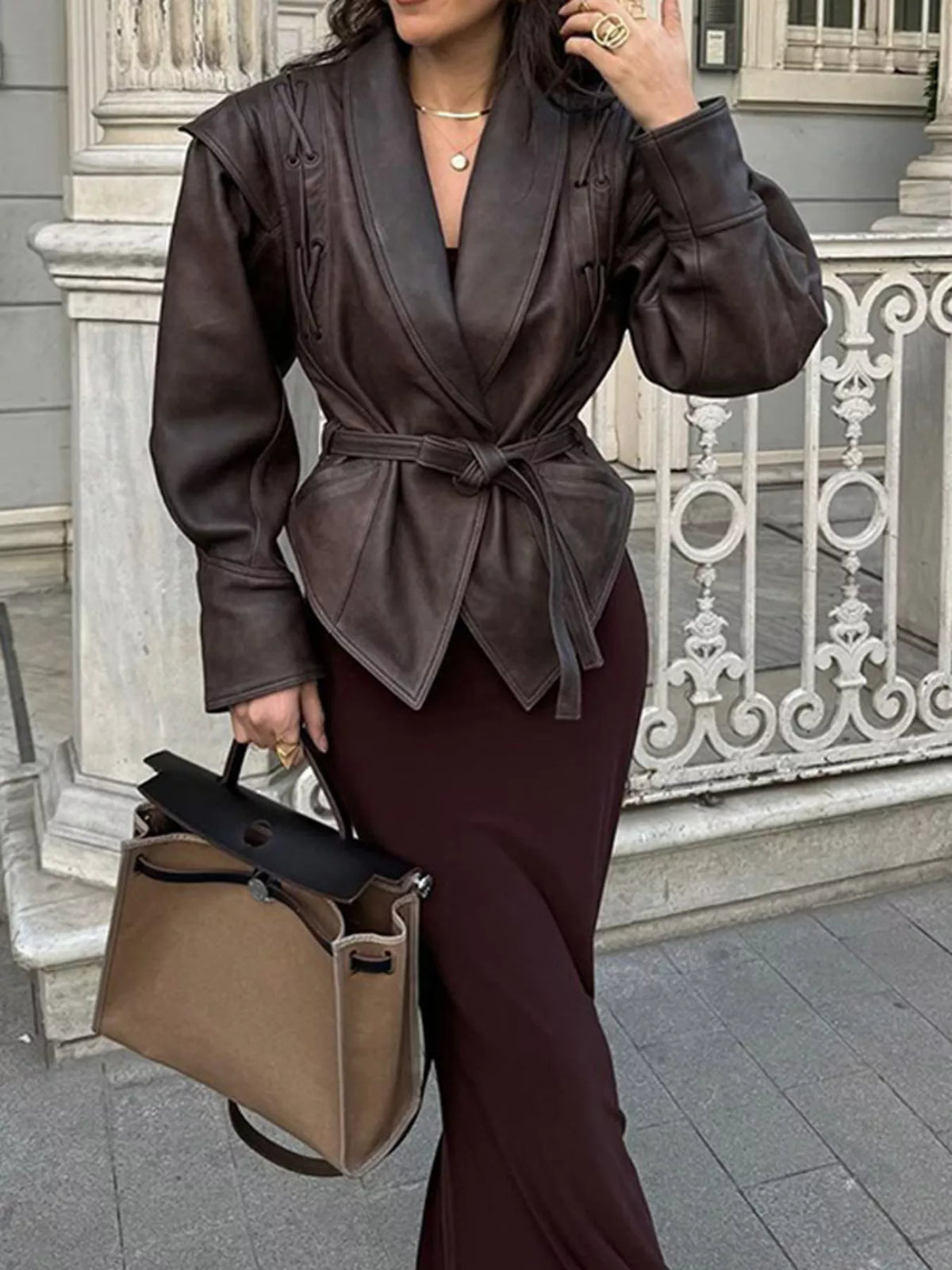Women's leather belted jacket with shawl collar from Trendsi, featuring a stylish design and classic silhouette.