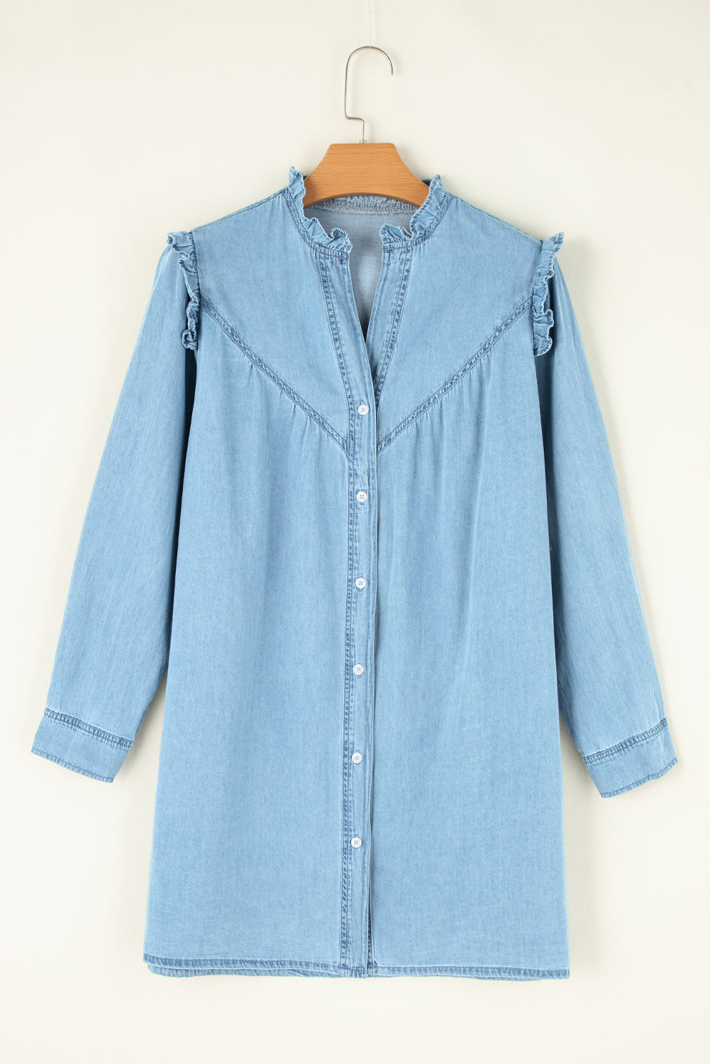 Long sleeve denim dress with button-up front and notched collar by Plush Fashion Hub, showcased on a model.