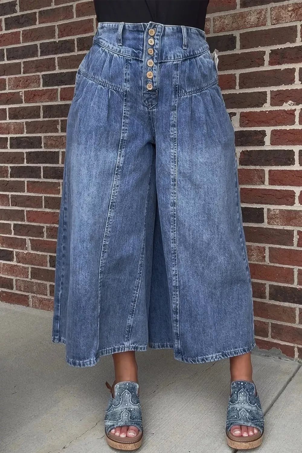 High-waisted wide-leg denim jeans by Trendsi featuring button-fly closure and classic cotton denim fabric.