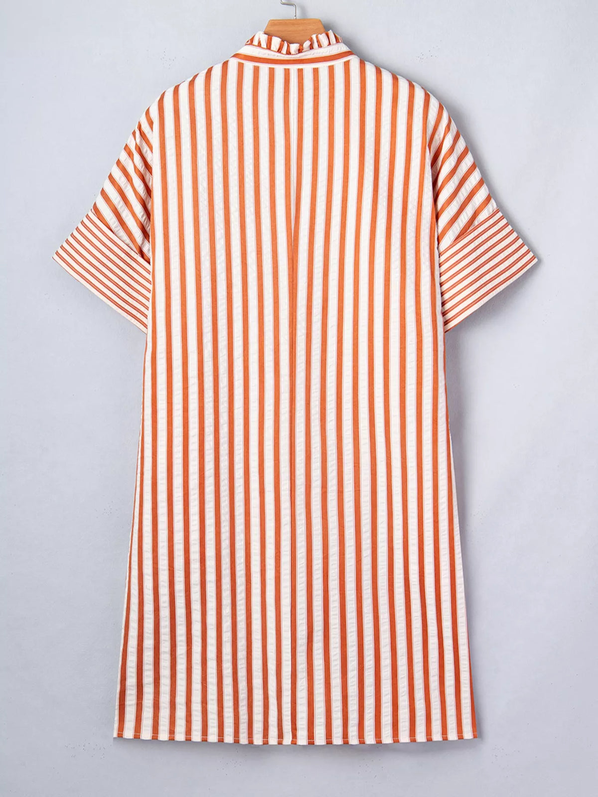 Striped V-neck mini dress from Plush Fashion Hub featuring cuffs, pockets, and a stylish design.