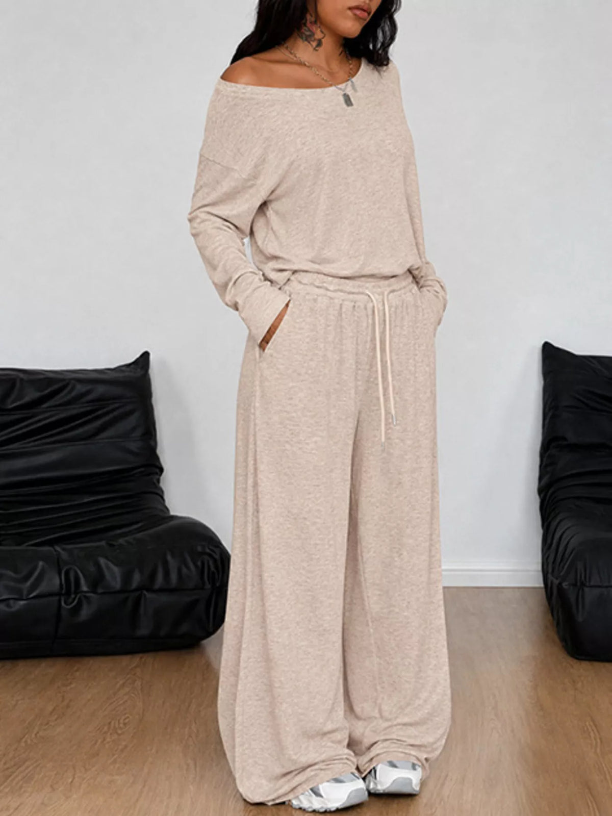 Plus size loose fit one-shoulder T-shirt and matching pants set by Trendsi, casual and comfortable clothing ensemble.
