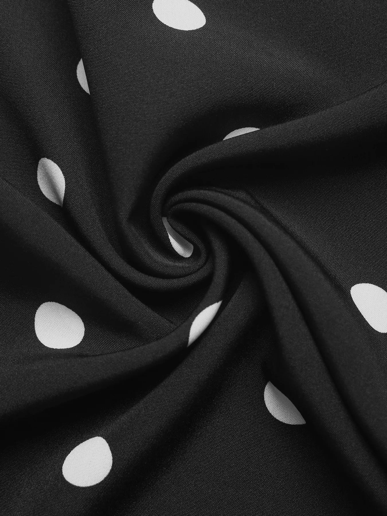Polka dot strapless wide-leg jumpsuit from Trendsi featuring a flowy, comfortable design and stylish fashion statement.