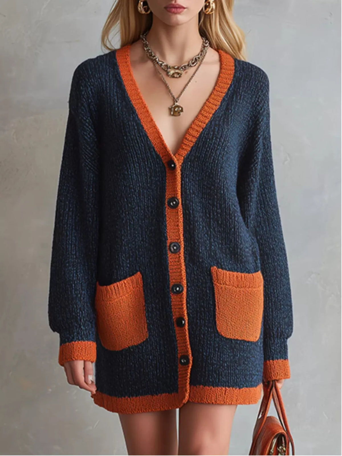 Color-block V-neck button-down knit cardigan by Trendsi, featuring vibrant color blocks and a classic V-neck design.