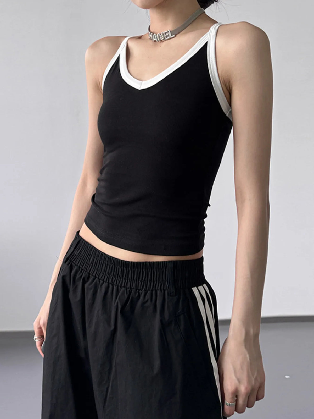 Contrast trim cami top by Plush Fashion Hub featuring a sleek design, adjustable straps, and stylish contrast detailing.