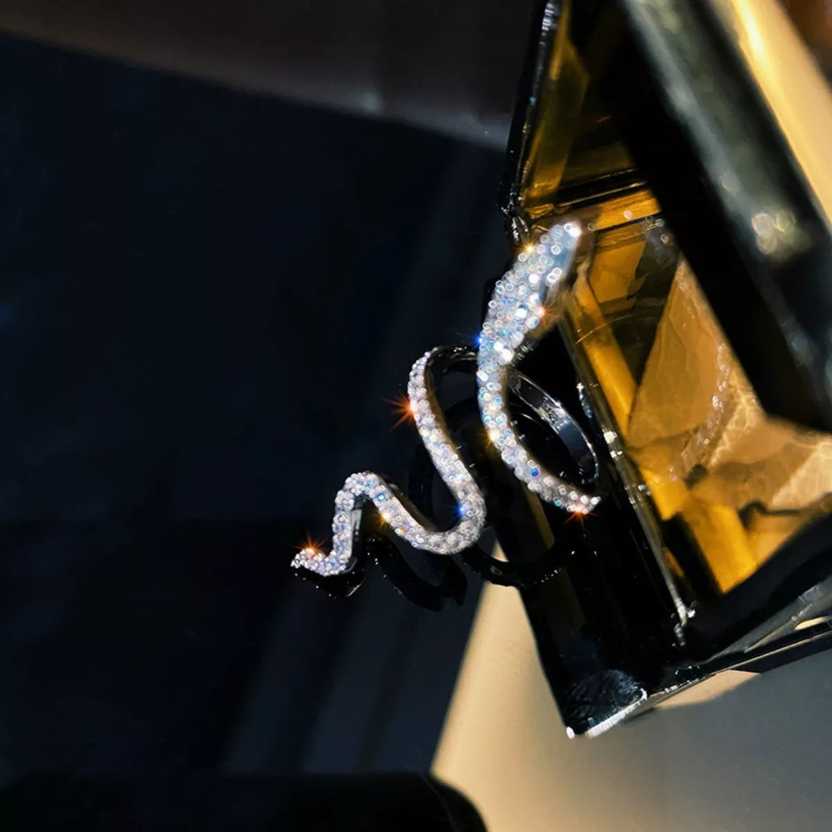 925 sterling silver zircon snake bypass ring with intricate design, showcasing sparkling stones and smooth band detail.