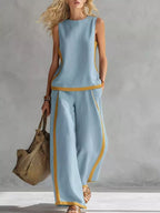Plus size contrast stripe sleeveless top and wide-leg pants set by Trendsi, featuring bold stripes and comfortable fit.