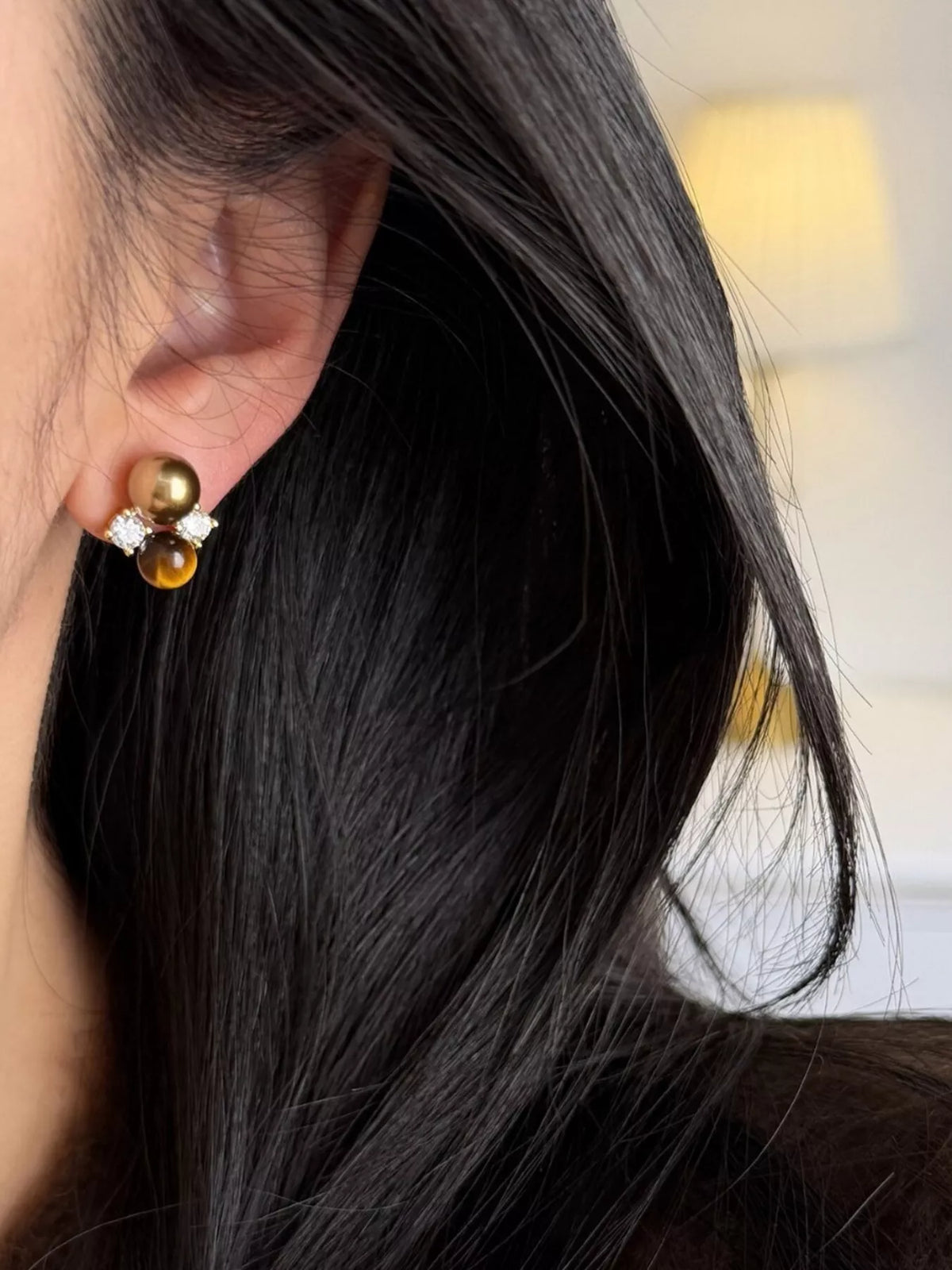 Plush Fashion Hub tiger eye stud earrings featuring smooth, polished gemstones set in silver-tone metal on a white background.