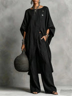 Women's casual FitiqueFit drop shoulder three-quarter sleeve irregular shirt and matching pants set, shown in a relaxed, stylish fit.