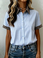 Women's leopard print short sleeve dress with contrast collar by Trendsi, featuring a stylish animal print and contrasting neckline.