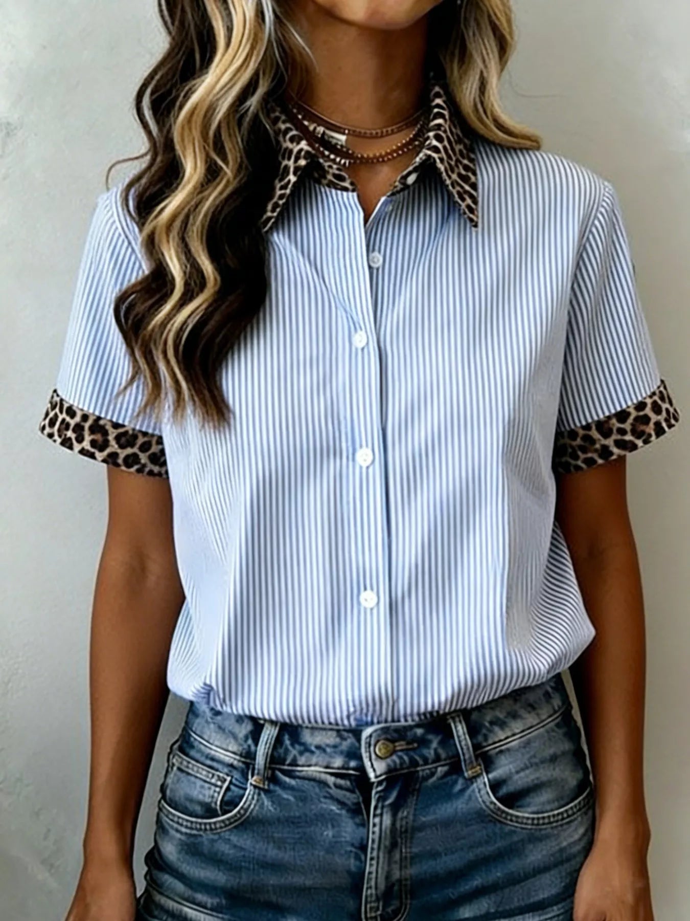 Women's leopard print short sleeve dress with contrast collar by Trendsi, featuring a stylish animal print and contrasting neckline.