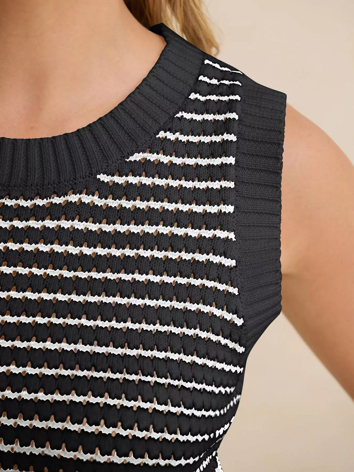 Striped knit sweater vest from Plush Fashion Hub, featuring a cozy design and colorful horizontal stripes.