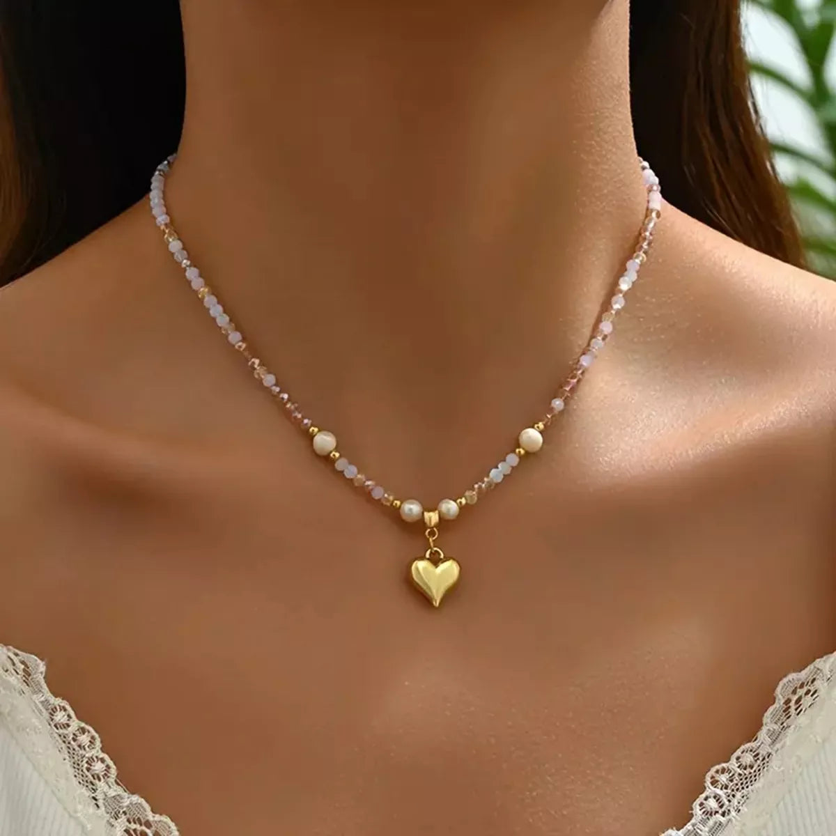 Bead heart pendant necklace by Plush Fashion Hub featuring a delicate heart-shaped design with colorful beads on a chain.