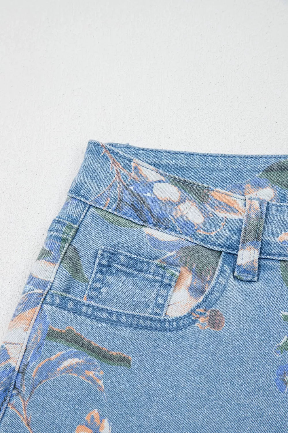 Floral print wide-leg jeans from Trendsi featuring a relaxed fit and vibrant floral design on lightweight denim fabric.