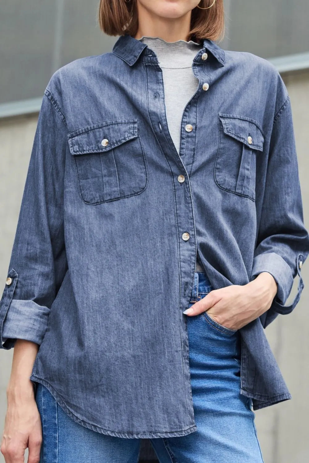 Trendsi denim top with long sleeves, collared neck, and front pockets, styled with a casual look.