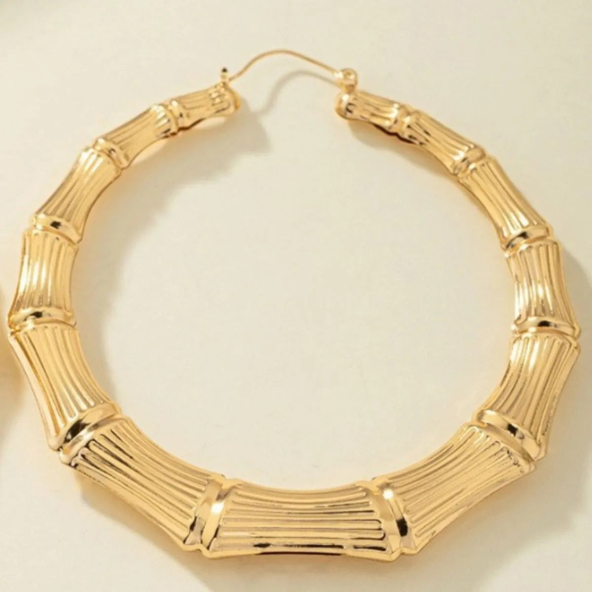 Stainless steel textured hoop earrings from Plush Fashion Hub, featuring a sleek and modern design.