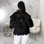 Women’s lace-up cardigan with lantern sleeves, hollow out cutouts, and flounce trim by Bella Mia outerwear.