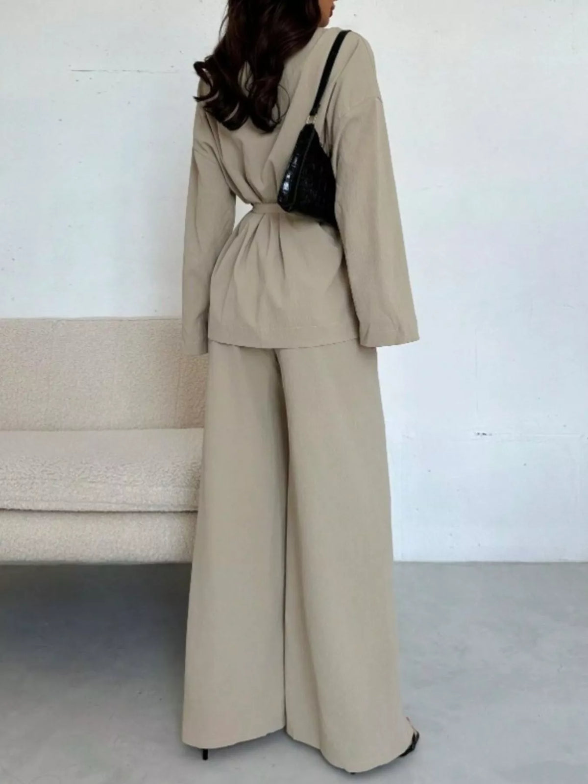 Textured tie waist top and wide-leg pants set for women, featuring a stylish, coordinated outfit with a relaxed fit and trendy design.