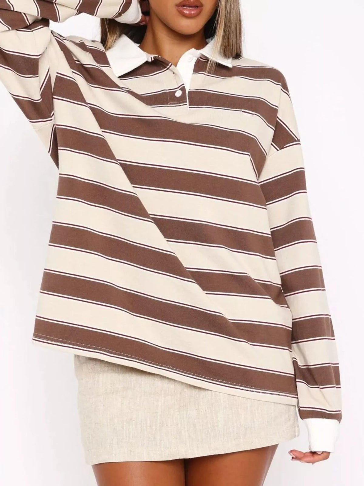 Striped long sleeve polo shirt with button details from Plush Fashion Hub, featuring a classic design and comfortable fit.