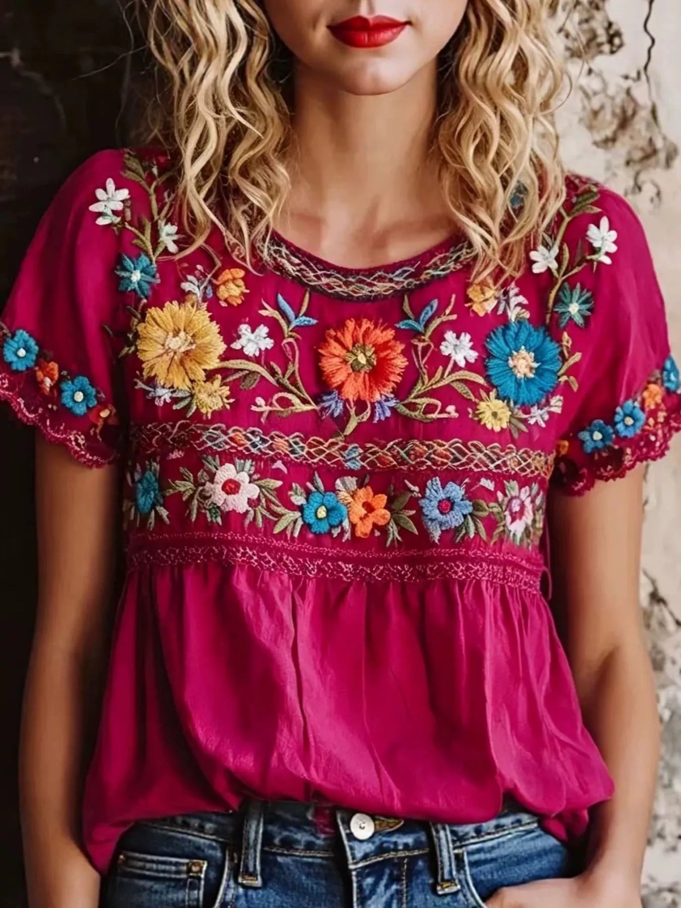 Plus size embroidered floral short sleeve top, trendy blous style with colorful floral embroidery on lightweight fabric.