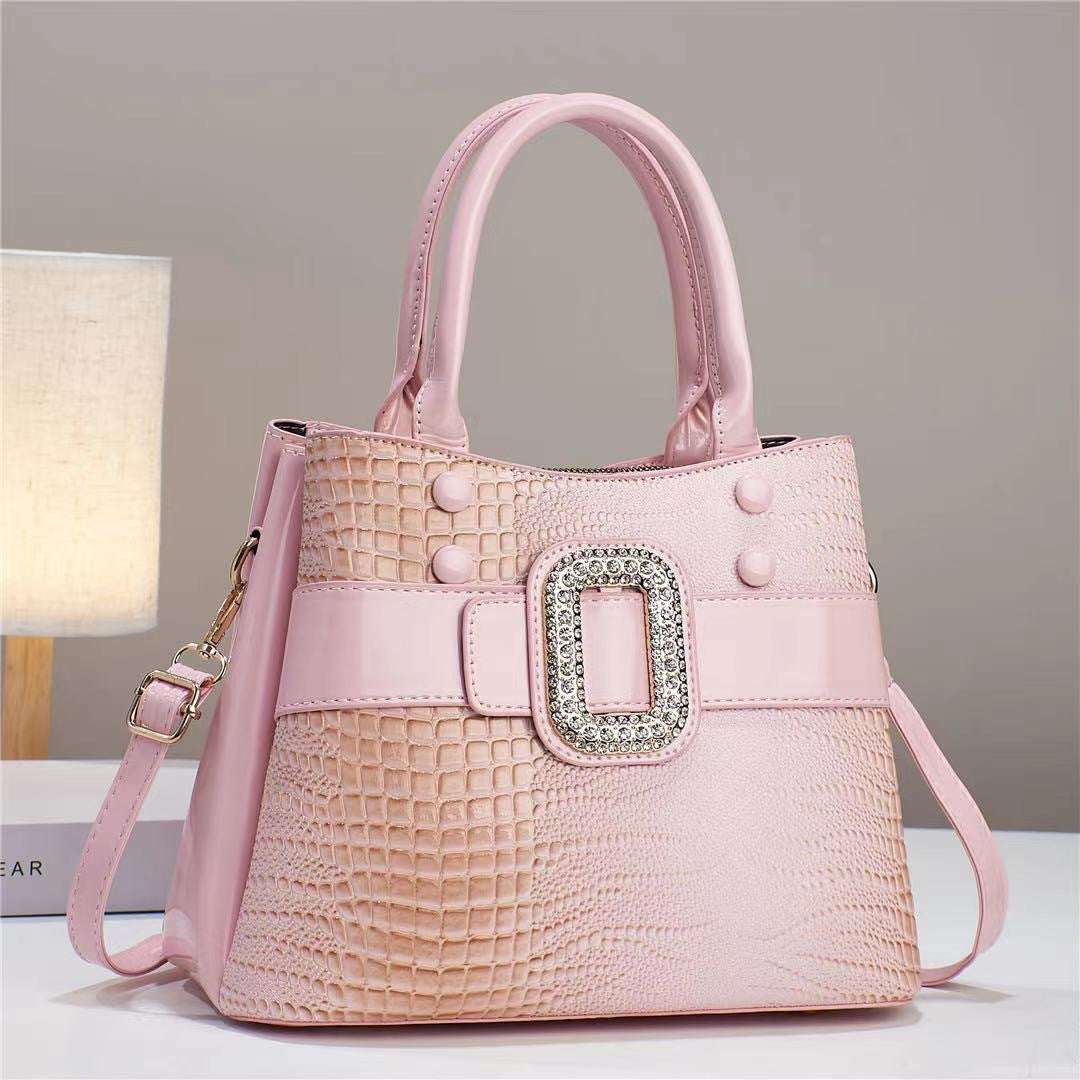 Lizard-patterned mini bucket crossbody bag with zipper from Plush Fashion Hub, featuring a stylish design and compact size.