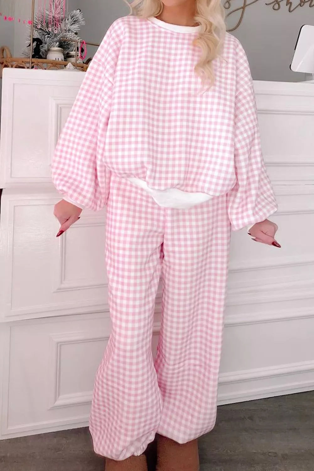 Women’s gingham round neck top and pants set by Trendsi, featuring a stylish matching print and comfortable fit.