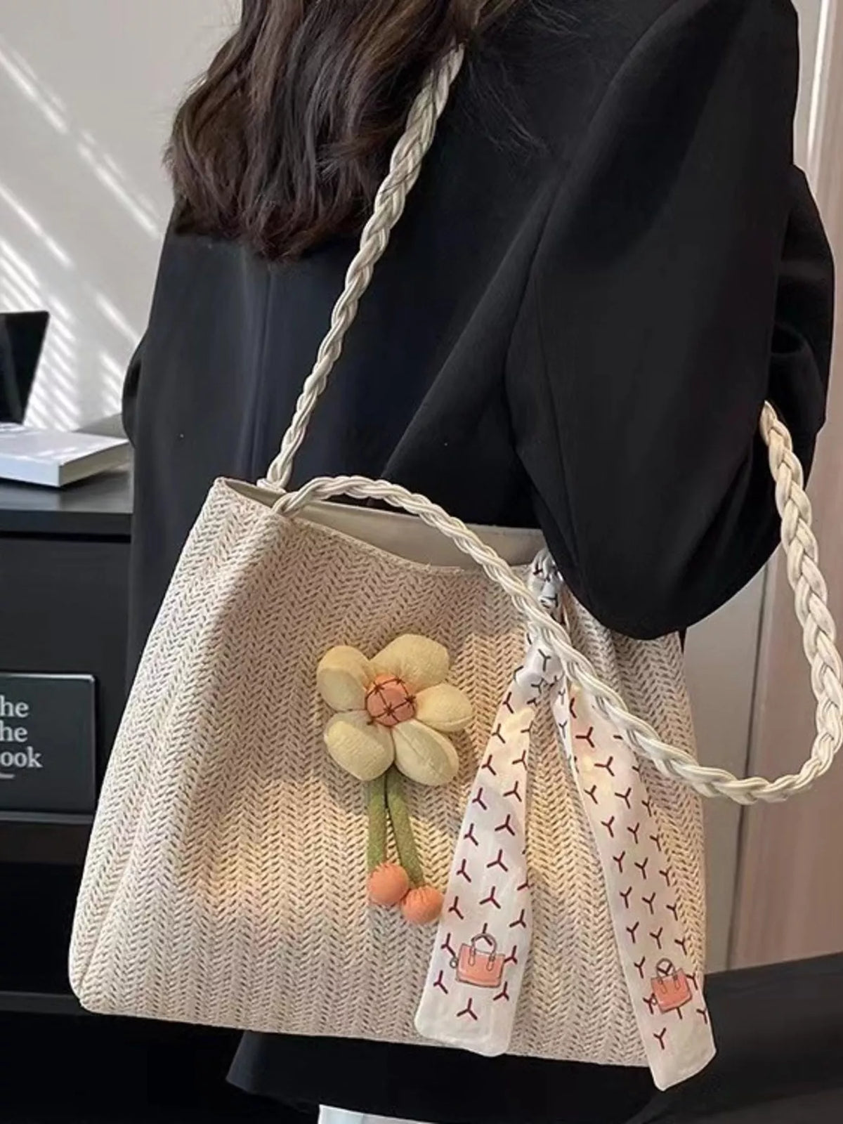 Woven straw tote bag with floral decor from Plush Fashion Hub, stylish eco-friendly bag for summer outings.