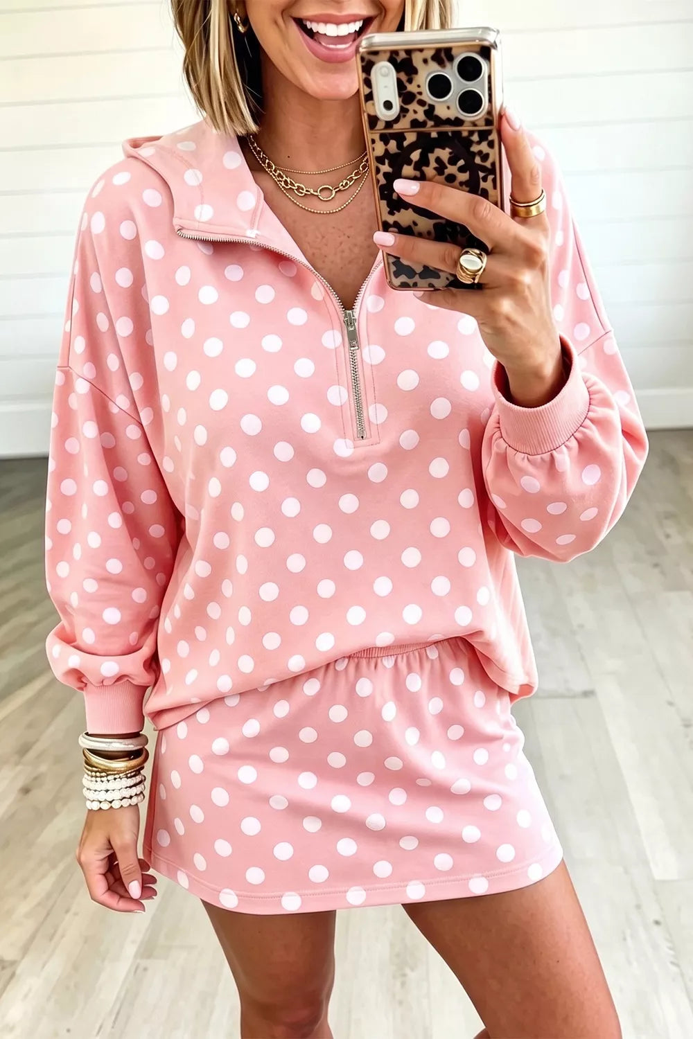 Polka dot quarter zip sweatshirt and shorts set for women by Trendsi, featuring a comfortable, casual loungewear look.