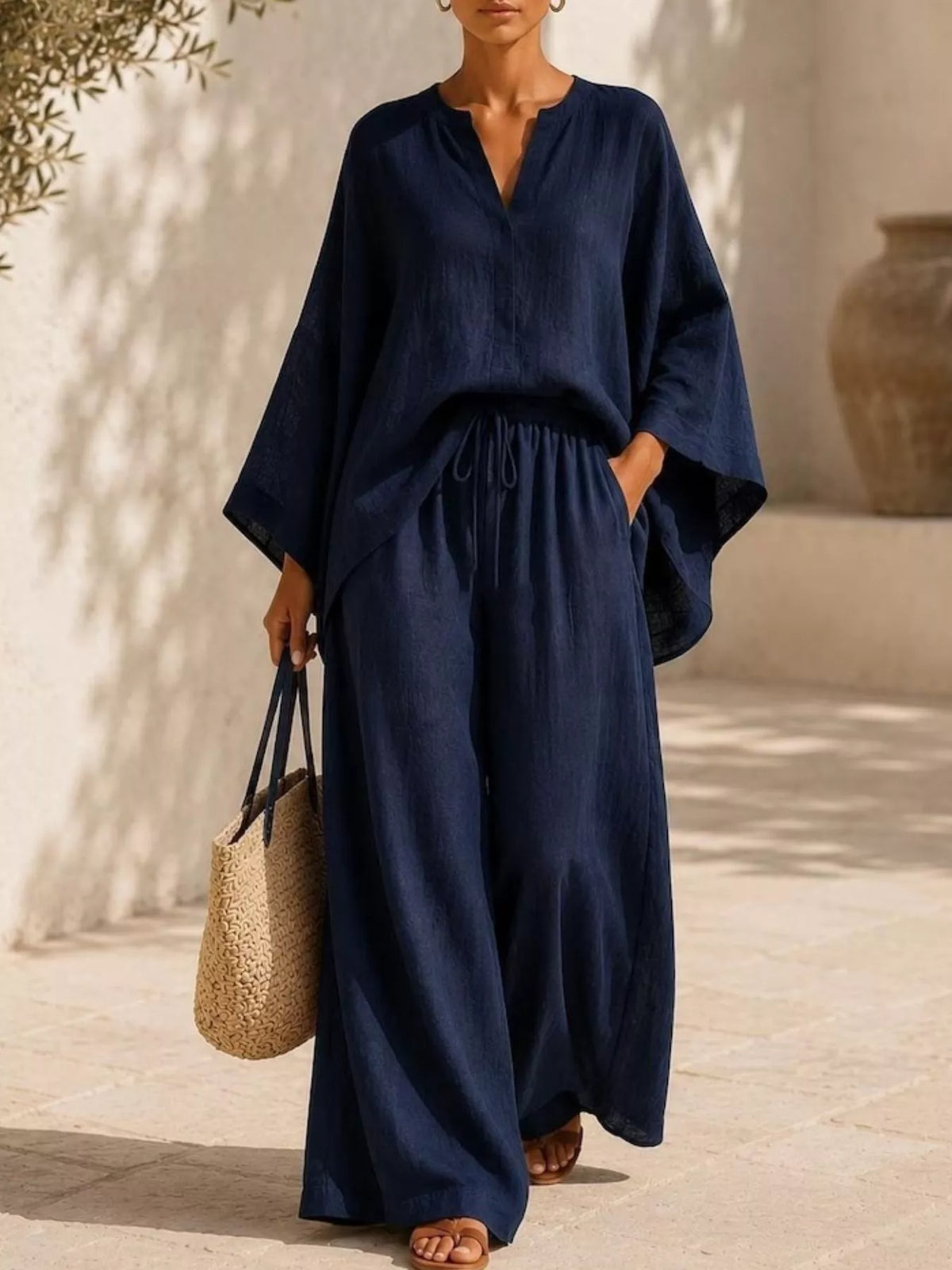 Plus size full notched long sleeve top and wide-leg pants loungewear set by Plush Fashion Hub, casual comfortable outfit for relaxing.