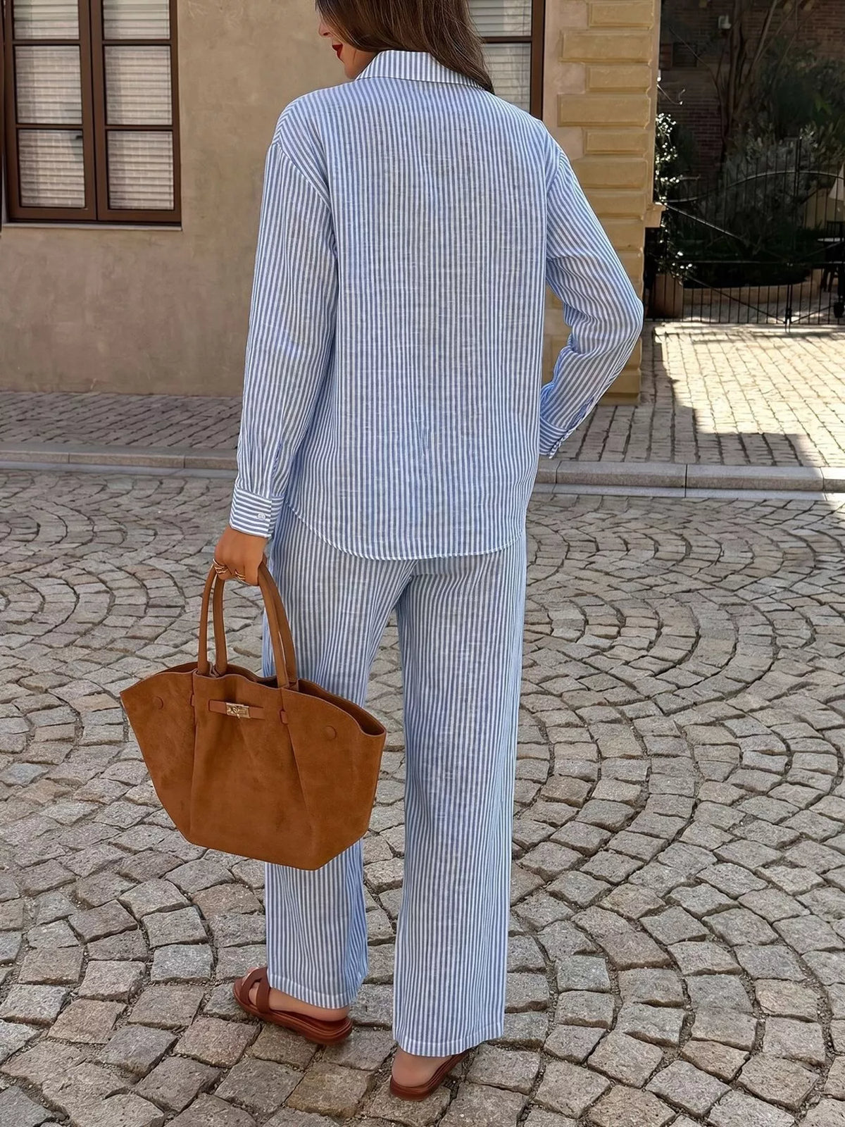 Striped button-up shirt and pants set by Trendsi, featuring a coordinated casual outfit with vertical stripe pattern.