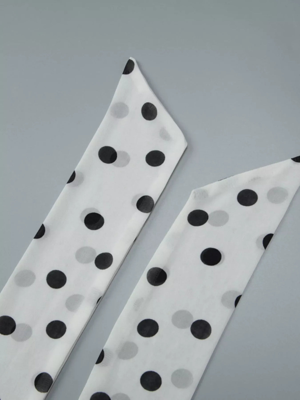 Polka dot halter neck ruffle dress by Plush Fashion Hub showing a stylish sleeveless dress with ruffle details and a halter neckline.