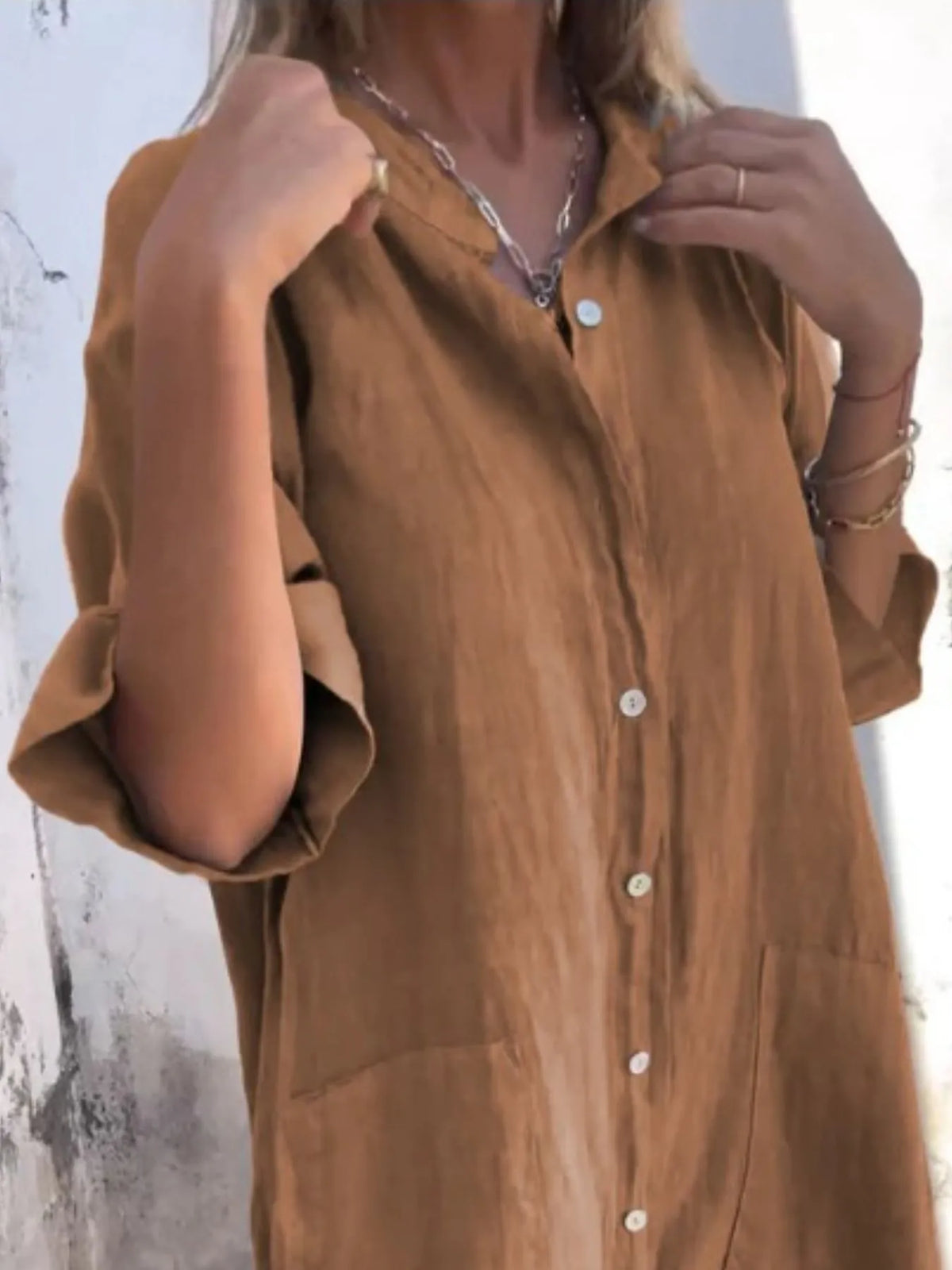 Plus size linen casual button-down shirt dress by Trendsi, featuring a relaxed fit and classic collar, displayed on a hanger.