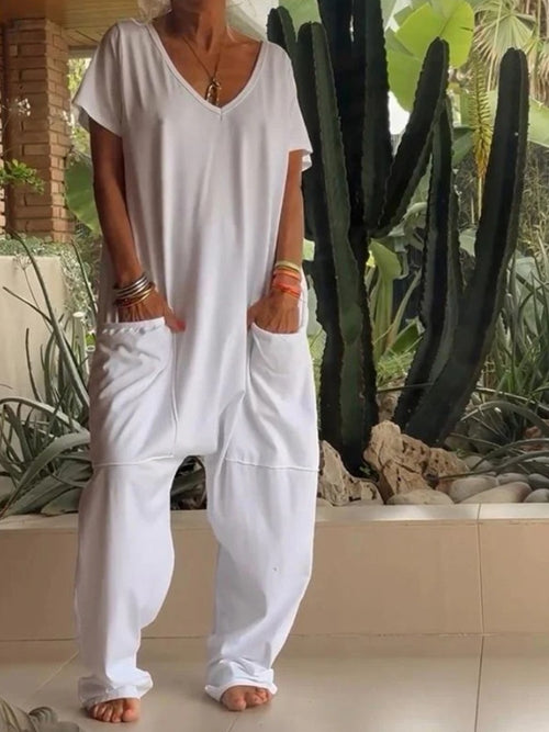 Plus size loose fit V-neck short sleeve jumpsuit with wide-leg pants, stylish and comfortable from Trendsi.