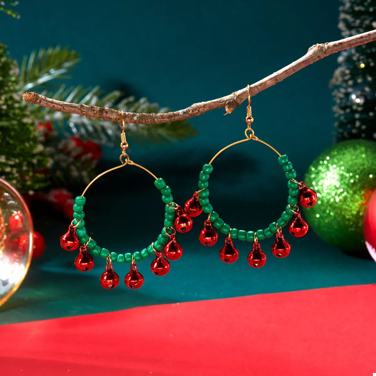 Plush Fashion Hub Christmas beaded hoop earrings with jingle bells and festive red and green beads, perfect for holiday accessories.