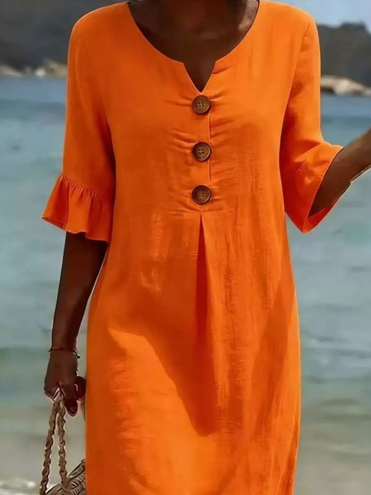 Plus size ruffle sleeve midi dress with button details by Plush Fashion Hub, showcasing flowy fabric and stylish design.