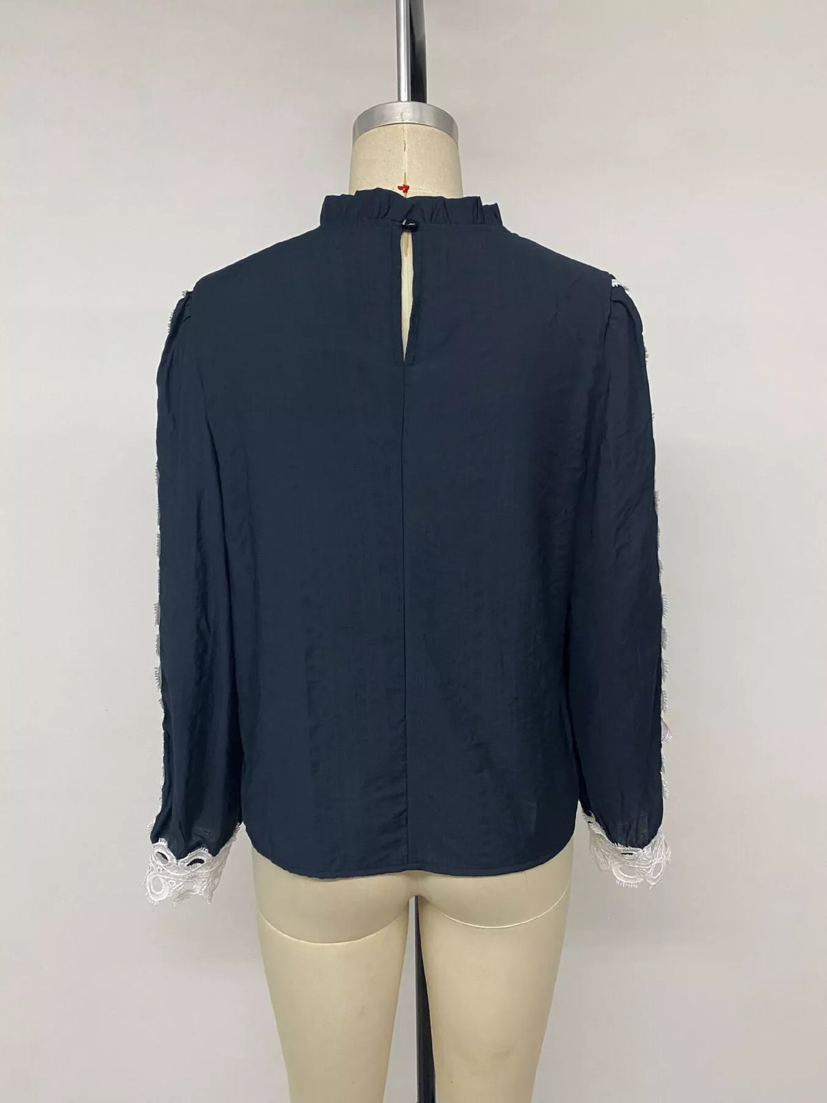 Lace trim long sleeves blouse by Trendsi featuring delicate lace details and a stylish, feminine fit.